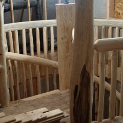 Character post at the top of the stairs | Log Spiral Stairs | Handcrafted Wood LLC