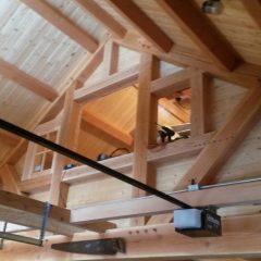 Interior office wall with windows allowing natural light | Timber Frame Garage | Handcrafted Wood LLC