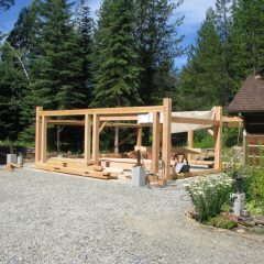 First posts and girts are set for the timber frame garage | Handcrafted Wood LLC