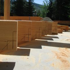 Timber purlins laid out for cutting | Handcrafted Wood LLC
