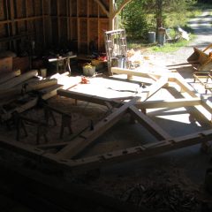 Crafting the timber frame members in the shop | Timber Frame Home | Handcrafted Wood LLC