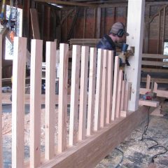 The loft railing is integrated into the interior truss | Timber Frame Home | Handcrafted Wood LLC