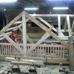 Another view of the timber frame before resetting on the build site | Timber Frame Home | Handcrafted Wood LLC