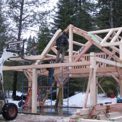 Setting the front bent and front truss | Timber Frame Home | Handcrafted Wood LLC
