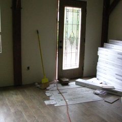 Laying the flooring | Timber Frame Home | Handcrafted Wood LLC