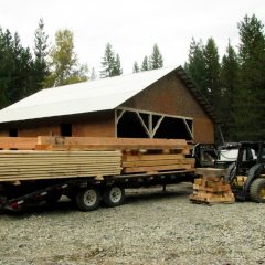 The timbers are disassembled and loaded for transport to the building site | Timber Frame Barn | Handcrafted Wood LLC