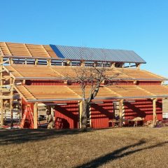 Metal roofing and siding installation | Timber Frame Barn | Handcrafted Wood LLC