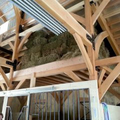 View of hay storage | Timber Frame Barn | Handcrafted Wood LLC
