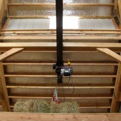 Hay storage and trolley with electric hay hoist | Timber Frame Barn | Handcrafted Wood LLC