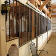 Low stall walls allow the miniature horses to see out | Timber Frame Barn | Handcrafted Wood LLC